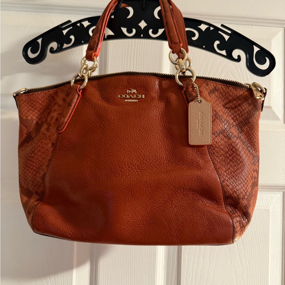 Coach - Brownish / Orange adjustable crossbody bag with snake skin designs!